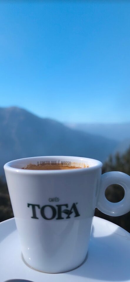 Espresso from Cafés TOFA with the valley behind